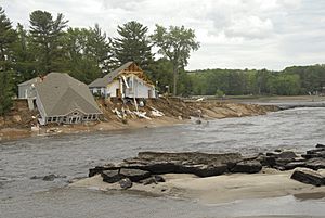 New Dell Creek Channel draining Lake Delton with wrecked homes