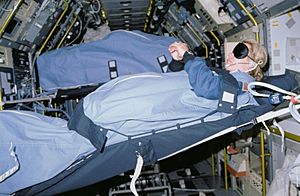 STS040-31-020 - STS-40 MS Seddon, wearing blindfold, sleeps in SLS-1 module