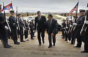 Secretary of Defense Leon E. Panetta, right, escorts Serbia's Minister of Defense Aleksandar Vucic through an honor cordon and into the Pentagon on Dec 121207-D-NI589-020