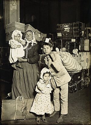 Italian family in the baggage room, Ellis Island, 1905