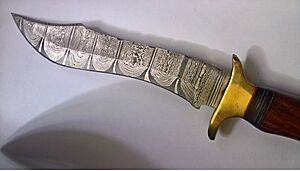 A masterpiece of blacksmith craftsmanship - Damascus knife in a very modern Bowie knife design forged from cannon steel from the Leopard I main battle tank. Length of the knife blade 26 centimeters. Picture one