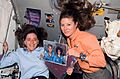 Barbara Morgan & Tracy Caldwell STS-118 on ISS with photo tributes (S118-E-09265)