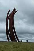 Large curved metal sculpture by Bernar Venet