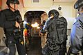 Flickr - Official U.S. Navy Imagery - SWAT team members breach a room and engage hostile targets in a training exercise.