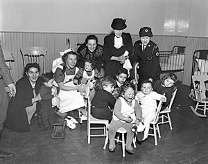 Immigrant Children with Red Cross Port Workers, Pier 21, Halifax, Nova Scotia, Canada, 1948