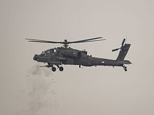 Kuwait Land Forces AH-64 Apache helicopter opens fire upon a series of targets during Al Tahreer