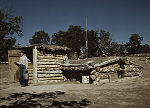 Homesteader with dugout house in Pie Town, 1940 photograph by Russell Lee.