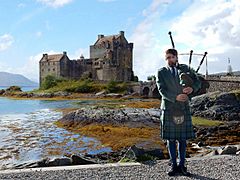 Piper at Eilean Donan Castle, Scotland