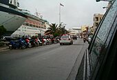 Police car drives westward on Front Street, City of Hamilton, Bermuda on 6 June 2006