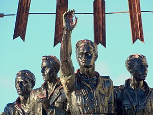 Photo of a monument depicting four persons