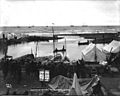 Boats and tents at the mouth of the Snake River, Nome, Alaska, ca 1900 (HEGG 571)