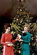 Pat Nixon and Julie Nixon Eisenhower Examine One of the Handmade State Christmas Tree Ornaments.jpg