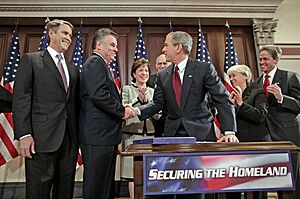 President George W. Bush shakes hands with Congressman Peter King, R-N.Y.