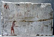 Photograph of personages in a relief