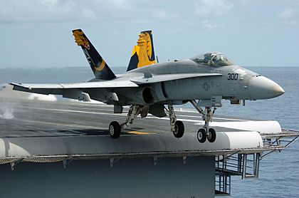 An F-A-18C Hornet launches from the flight deck of the conventionally powered aircraft carrier