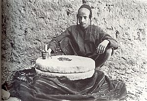 Jewish youth grinding coffee on millstone, Sana'a (Yemen) 1934
