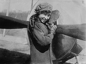 Katherine Stinson standing in front of an aircraft