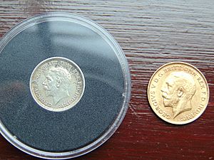 London Mint Office 1935 Threepence with 1911 Half Sovereign for scale