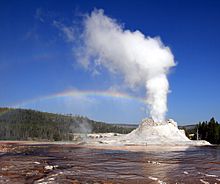 Steam Phase eruption of Castle geyser with double rainbow