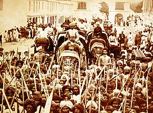 The Nizam VI riding an elephant in a procession from Moula Ali, circa. 1895
