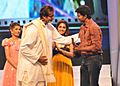 Vijay receiving award from amitabh 2011