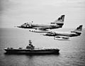 A-4C Skyhawks of VA-146 fly past USS Kearsarge (CVS-33) in the South China Sea on 12 August 1964 (USN 1107965)