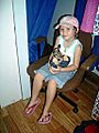 Child holding rescued Agile Wallaby joey. Cooktown. 2008