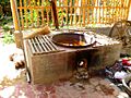 Dye in pan on stove. Khotan, Xinjiang