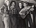Four students with guitar