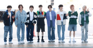 The eight members of Stray Kids, look forward