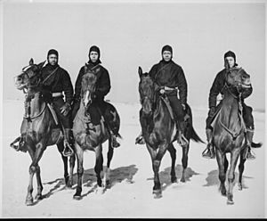 These Negro members of a Coast Guard Horse Patrol unit patrol beaches in the New Jersey area in all kinds of weather. - NARA - 535853
