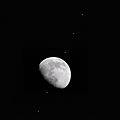 Composite of 6 photos of the ISS transiting the gibbous Moon