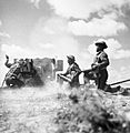 Ghurkas in action with a 6-pdr anti-tank gun in Tunisia, 16 March 1943. NA1103