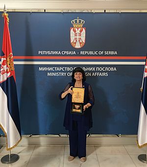 Knight of the St. Sava Order of Diplomatic Pacifism ceremony 2018 - Rosie Stephenson-Goodknight (cropped)