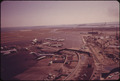 LOGAN AIRPORT-CONSTRUCTION OF NEW TERMINAL ON RIGHT BOSTON HARBOR IN BACKGROUND - NARA - 548430