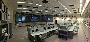 Mission Operation Control Room 2 in the Christopher C. Kraft Jr. Mission Control Center, looking across the consoles from the corner of the room (prior to the 2019 restoration)