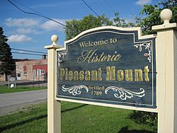 The welcome sign for the Village of Pleasant Mount.