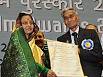 Pratibha Devisingh Patil presenting the Dada Saheb Phalke Award for the year 2008 to the legendary Cinematographer, Shri V.K. Murthy, at the 56th National Film Awards function, in New Delhi on March 19, 2010 (1) (cropped).jpg