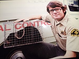 San Diego County Animal Control Officer, Tom Van Wagner, with Tasmanian devil he captured after it escaped from the San Diego Zoo