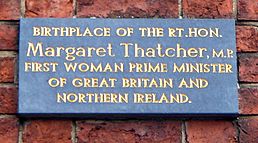 photograph of a plaque reading "Birth place of the Rt.Hon. Margaret Thatcher, M.P. First woman prime minister of Great Britain and Northern Ireland"