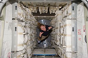 STS-135 Sandy Magnus floats freely in the Raffaello MPLM
