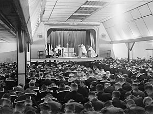 The Archbishop of Canterbury conducts a service in the cinema at Flotta on Orkney during his visit to the Home Fleet at Scapa Flow, 6 September 1942. A11549
