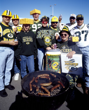 "Cheesehead" fans of the Green Bay Packers football team come out in droves with their head gear and bratwursts to support the team in Green Bay, Wisconsin LCCN2011631283