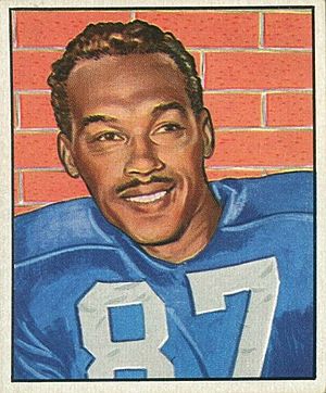 A football card showing a portrait of Mann in his blue Yanks jersey