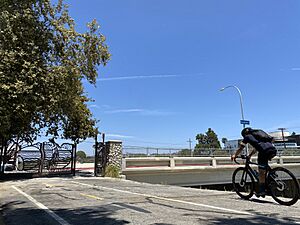 Cyclist using Ballona Creek Bike Path near Sepulveda gate