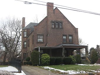 Image of a two-story brown brick residential building