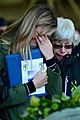 From left, Sarah Stover, the widow of U.S. Air Force Capt. Christopher Stover, an HH-60G Pave Hawk helicopter pilot assigned to the 56th Rescue Squadron, pays tribute to her husband during a memorial service 140117-F-XB934-225