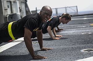 Service members perform physical training as part of stress management 150729-M-GO800-063