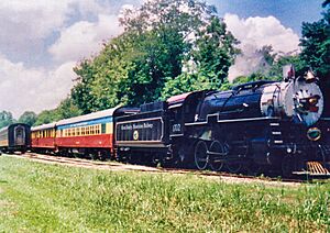 The Great Smoky Mountains Railway is pictured in the 1990s with its bright "circus train" livery