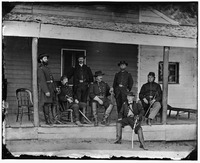 Washington, D.C. Maj. Gen Alexander M. McCook (center) and staff on porch of quarters, Brightwood (7th Street Road near present Sheridan St. LOC cwpb.04115